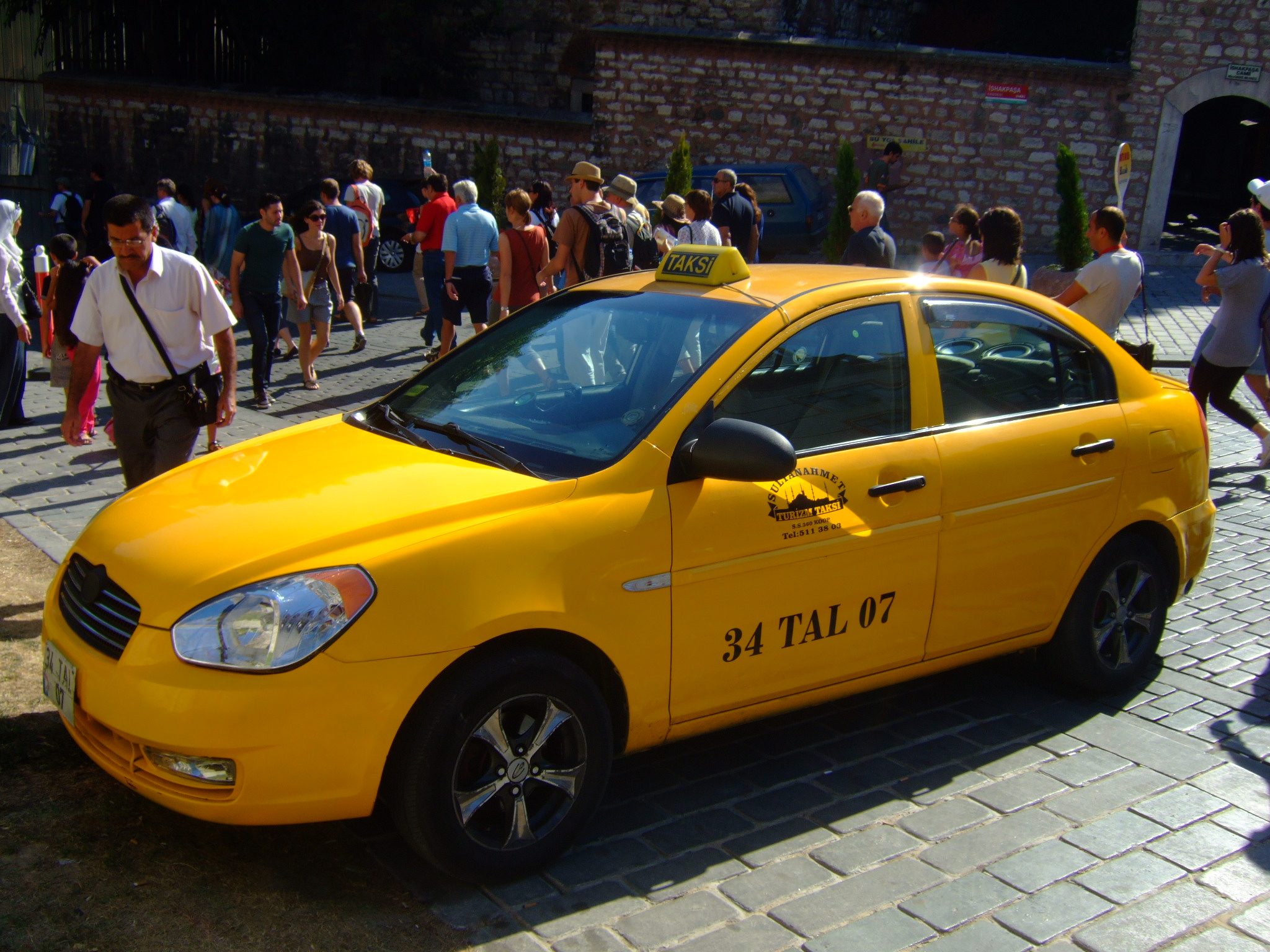Yellow Istanbul taxi on a city street — the official licensed taxi colour for Istanbul